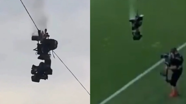 Sebuah kamera terjun ke tanah di tengah pertandingan sepak bola, nyaris menghindari bencana