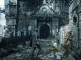 Komunitas Demon's Souls berdiri di depan sebuah pintu yang terkunci